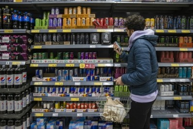 GettyImages - man browsing energy drinks / SolStock